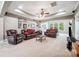 This spacious living room boasts a tray ceiling, neutral colored walls, and leather furniture at 16547 Bastille Dr, Charlotte, NC 28278