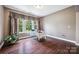 Bright, well-lit office space with hardwood floors, a large window, and modern decor at 16547 Bastille Dr, Charlotte, NC 28278