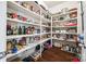 Walk-in pantry with custom shelving offers ample storage for food and kitchen essentials at 16547 Bastille Dr, Charlotte, NC 28278