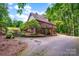 Back exterior of the home with multiple decks, brick siding, and an attached garage at 169 Primrose Ln, Statesville, NC 28625