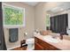 Bathroom features a sink, toilet and mirror at 169 Primrose Ln, Statesville, NC 28625