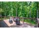 Outdoor deck surrounded by lush greenery with comfortable seating area at 169 Primrose Ln, Statesville, NC 28625