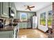 Charming kitchen with painted cabinets, stainless appliances, and beautiful outdoor views at 169 Primrose Ln, Statesville, NC 28625