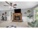 Bright living area featuring fireplace, wooden mantel, and view into the kitchen at 169 Primrose Ln, Statesville, NC 28625