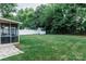 Spacious backyard featuring a shed, fenced perimeter, and screened porch at 1699 Riverdale Dr, Rock Hill, SC 29732