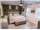 Cozy bedroom with a shiplap accent wall, neutral decor, white bed, and a soft rug for a relaxing ambiance at 1699 Riverdale Dr, Rock Hill, SC 29732