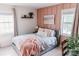 Serene bedroom featuring pink accent wall, soft textures, and natural light for a calming retreat at 1699 Riverdale Dr, Rock Hill, SC 29732