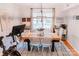 Inviting dining room featuring a wooden table, white chairs, and a stylish chandelier at 1699 Riverdale Dr, Rock Hill, SC 29732