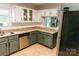 Updated kitchen featuring granite counters, stainless steel appliances, and stylish two-tone cabinets at 1699 Riverdale Dr, Rock Hill, SC 29732