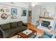 Cozy living room with a fireplace, comfortable seating, and a decorative glass paneled door at 1699 Riverdale Dr, Rock Hill, SC 29732