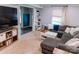 Comfortable living room features a large sectional sofa, bright window, and stylish decor at 1699 Riverdale Dr, Rock Hill, SC 29732
