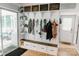 Inviting mudroom with custom built-ins, shelving, and bench seating, perfect for organization at 1699 Riverdale Dr, Rock Hill, SC 29732