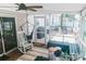 Inviting screened-in porch with relaxing hammock chair and exterior deck at 1699 Riverdale Dr, Rock Hill, SC 29732