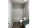 Cozy bathroom featuring a shower-tub, toilet, and green countertop sink at 1714 Maribel Ave, Charlotte, NC 28216