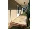 Covered front porch with brick base and dark-green support beams offers a welcoming entrance to the home at 1714 Maribel Ave, Charlotte, NC 28216
