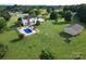 Aerial view of home with lush yard, inground pool, and detached outbuilding at 212 Countryside Rd, Kings Mountain, NC 28086