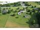 Aerial view of the property with a pool, outbuilding and an expansive lawn at 212 Countryside Rd, Kings Mountain, NC 28086