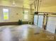 Spacious two-car garage with windows, brick accent and bright lighting at 212 Countryside Rd, Kings Mountain, NC 28086