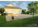 Spacious three-door garage featuring an expansive driveway and lush landscaping at 212 Countryside Rd, Kings Mountain, NC 28086