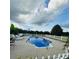 In-ground pool with diving board and white picket fence at 212 Countryside Rd, Kings Mountain, NC 28086