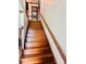 Wooden staircase featuring classic banister that adds charm to the home's interior at 212 Countryside Rd, Kings Mountain, NC 28086