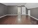 Spacious room with hardwood floors and ample closet space perfect for a bonus room or storage at 216 Devon Forest Dr, Mooresville, NC 28115