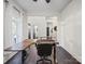 Spacious home office featuring a stylish desk, ergonomic chair, and ample lighting for a productive workspace at 216 Devon Forest Dr, Mooresville, NC 28115