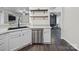 This bright kitchen features white cabinets, stainless steel appliances, and open shelving at 216 Devon Forest Dr, Mooresville, NC 28115