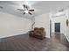 A warm living room featuring hardwood floors, and a comfortable couch at 216 Devon Forest Dr, Mooresville, NC 28115