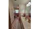Bathroom featuring retro pink tile, updated lighting, and an ample vanity and counter at 3546 Kershaw Camden Hwy, Lancaster, SC 29720