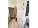 Bathroom features a tall linen closet, retro pink tile, and an open doorway at 3546 Kershaw Camden Hwy, Lancaster, SC 29720
