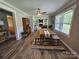 Charming dining room with wood floors, farmhouse table, and easy access to the living area and kitchen at 3546 Kershaw Camden Hwy, Lancaster, SC 29720