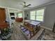 Bright dining room featuring a farmhouse table, natural light, and an open view to the cozy living room at 3546 Kershaw Camden Hwy, Lancaster, SC 29720