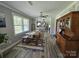 The dining room features a farmhouse table and wood floors, offering a rustic space for Gathering meals at 3546 Kershaw Camden Hwy, Lancaster, SC 29720