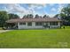 Charming one-story home with a white brick exterior and well-manicured front lawn at 3546 Kershaw Camden Hwy, Lancaster, SC 29720
