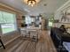 Well-lit kitchen featuring stainless steel appliances, a peninsula island, and views of the front yard at 3546 Kershaw Camden Hwy, Lancaster, SC 29720