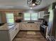 Kitchen features stainless appliances, granite countertops, and ample storage for a modern cooking experience at 3546 Kershaw Camden Hwy, Lancaster, SC 29720