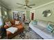 Inviting living room features neutral tones, a ceiling fan, and a doorway view to the kitchen and dining area at 3546 Kershaw Camden Hwy, Lancaster, SC 29720