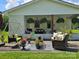 Inviting outdoor patio with comfortable seating, decorative plants, and a charming swing at 3546 Kershaw Camden Hwy, Lancaster, SC 29720