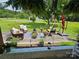 Inviting outdoor patio with comfortable seating, decorative plants, and a charming swing at 3546 Kershaw Camden Hwy, Lancaster, SC 29720