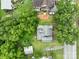 Aerial view of house with mature trees, road access, and a spacious backyard, providing a private setting at 357 N Main St, Mount Pleasant, NC 28124