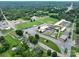 Aerial view of a local baseball field, schools, and well-maintained roads near the property at 357 N Main St, Mount Pleasant, NC 28124