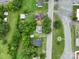 Aerial view of a home nestled among mature trees, offering privacy and a serene setting at 357 N Main St, Mount Pleasant, NC 28124