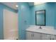 Bathroom featuring a pedestal sink, shower and painted blue walls at 357 N Main St, Mount Pleasant, NC 28124