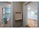 View of the half bathroom with blue painted walls and new toilet at 357 N Main St, Mount Pleasant, NC 28124