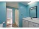 Bathroom featuring a pedestal sink, shower and painted blue walls at 357 N Main St, Mount Pleasant, NC 28124