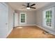 Bedroom featuring light gray walls, refinished floors, a ceiling fan and natural light at 357 N Main St, Mount Pleasant, NC 28124
