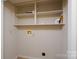 Laundry room with shelving and electrical box at 357 N Main St, Mount Pleasant, NC 28124