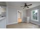 Living room featuring neutral paint, window, and a ceiling fan at 357 N Main St, Mount Pleasant, NC 28124
