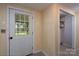This mudroom features a storage closet, access to the exterior and neutral paint tones at 357 N Main St, Mount Pleasant, NC 28124
